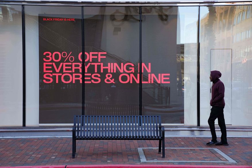 Shoppers browse for Black Friday deals at Atlantic Station outdoor mall, Friday, Nov. 28, 2025, in Atlanta, Ga. (AP Photo/Megan Varner)