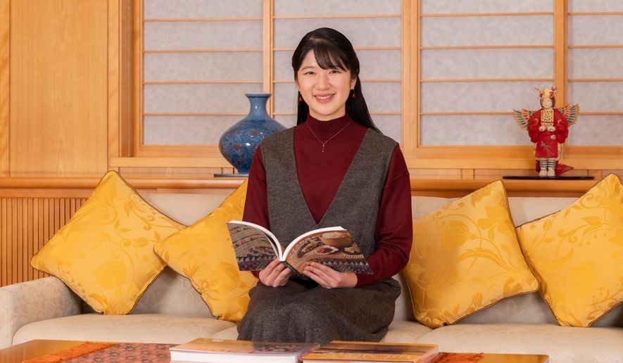 In this photo provided by the Imperial Household Agency of Japan, Princess Aiko, the daughter of Japan's Emperor Naruhito and Empress Masako, poses for a photo at the Imperial Palace in Tokyo, Friday, Nov. 7, 2025. (Imperial Household Agency of Japan via AP)