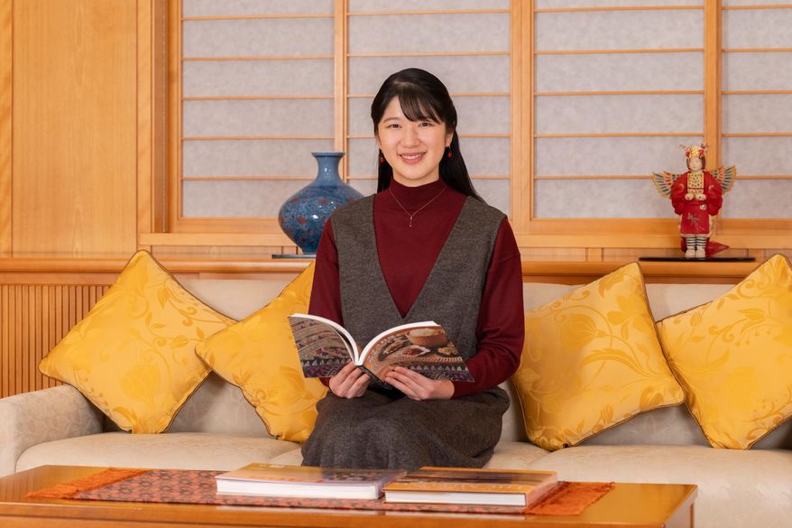In this photo provided by the Imperial Household Agency of Japan, Princess Aiko, the daughter of Japan's Emperor Naruhito and Empress Masako, poses for a photo at the Imperial Palace in Tokyo, Friday, Nov. 7, 2025. (Imperial Household Agency of Japan via AP)