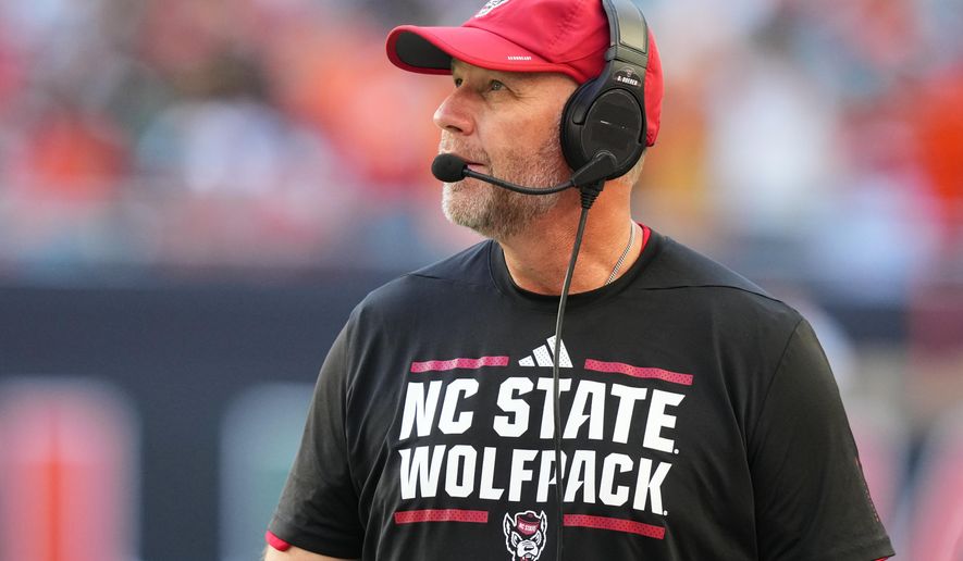 North Carolina State head coach Dave Doeren watches during the first half of an NCAA college football game against Miami, Saturday, Nov. 15, 2025, in Miami Gardens, Fla. (AP Photo/Lynne Sladky)
