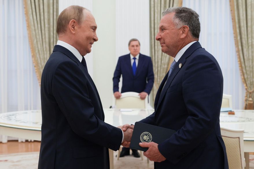 Russian President Vladimir Putin and U.S. President Donald Trump's special envoy Steve Witkoff shake hands during their meeting at the Kremlin, in Moscow, on Aug. 6, 2025. (Gavriil Grigorov, Sputnik, Kremlin Pool Photo via AP, File)