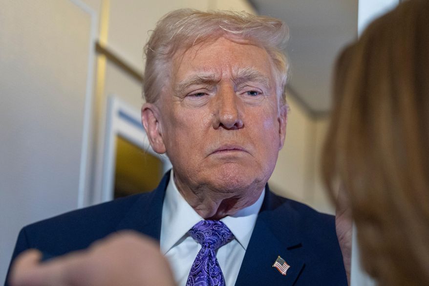 President Donald Trump speaks with reporters while in flight on Air Force One from his Mar-a-Lago estate in Palm Beach, Fla., to Joint Base Andrews, Sunday, Nov. 30, 2025. (AP Photo/Alex Brandon)