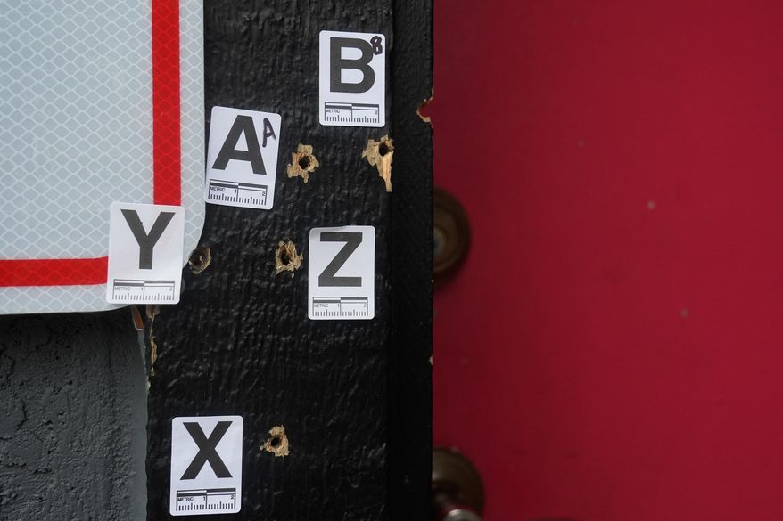 Bullet holes are shown where a mass shooting took place Saturday at a banquet hall in Stockton, Calif., Monday, Dec. 1, 2025. (AP Photo/Jeff Chiu)