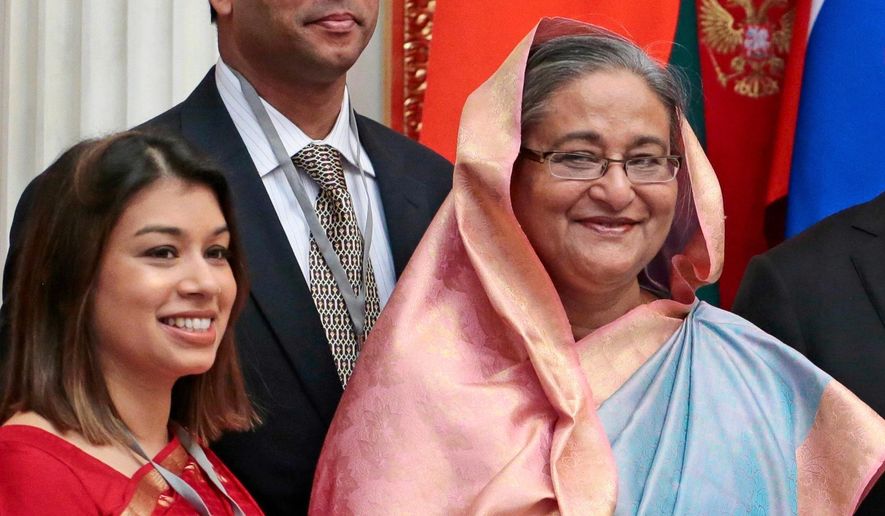 Tulip Siddiq, left, stands beside Bangladesh Prime Minister Sheikh Hasina in the Kremlin in Moscow, Russia, on Jan. 15, 2013. (AP Photo/Mikhail Metzel, Pool, File)