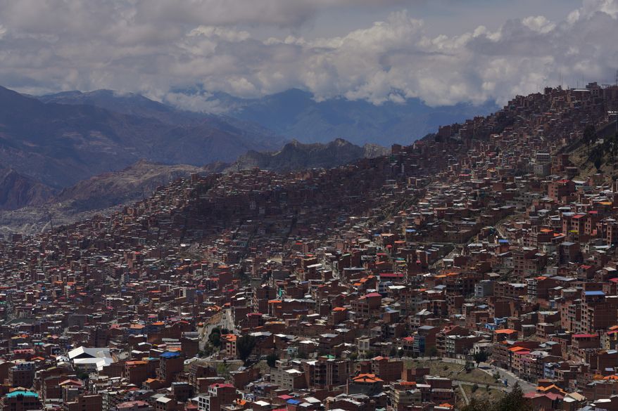 FILE - Clouds hang over the mountains surrounding La Paz, Bolivia, Oct. 19, 2025. (AP Photo/Ivan Valencia, File)