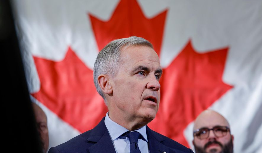 Prime Minister Mark Carney meets with ironworkers in Calgary, Alta., Thursday, Nov. 27, 2025. (Jeff McIntosh /The Canadian Press via AP)