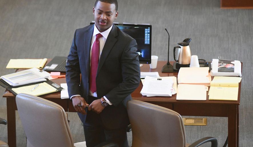 FILE - Sheldon Timothy Herrington Jr., who is on trial on a capital murder charge in the 2022 death of University of Mississippi student Jimmie "Jay" Lee, looks out into the courtroom during the lunch break, in Oxford, Miss. on Dec. 3, 2024. (Bruce Newman/The Northeast Daily Journal via AP, Pool, File)