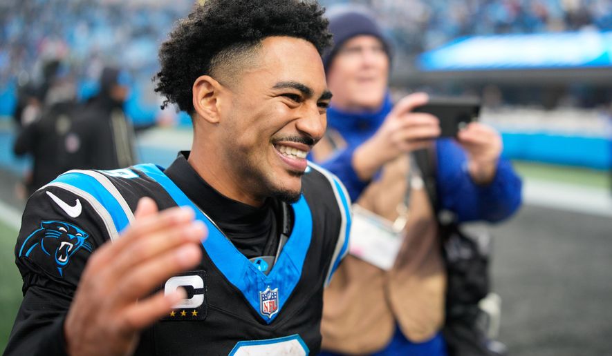 Carolina Panthers quarterback Bryce Young celebrates after an NFL football game between the Carolina Panthers and the Los Angeles Rams, Sunday, Nov. 30, 2025, in Charlotte, N.C. (AP Photo/Jacob Kupferman)