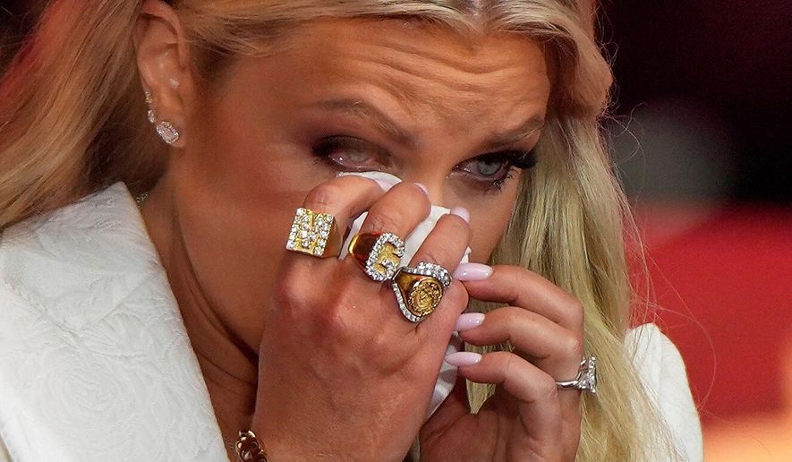 Erika Kirk wipes tears as she prepares to speak at a memorial for her husband, conservative activist Charlie Kirk, on Sept. 21, 2025, in Glendale, Ariz. (AP Photo/Julia Demaree Nikhinson, File)