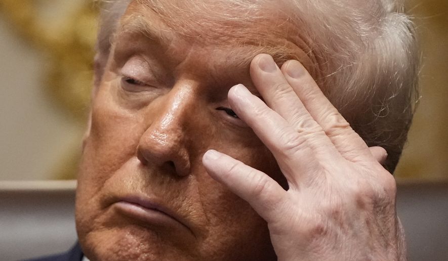 President Donald Trump listens during a cabinet meeting at the White House, Tuesday, Dec. 2, 2025, in Washington. (AP Photo/Julia Demaree Nikhinson)