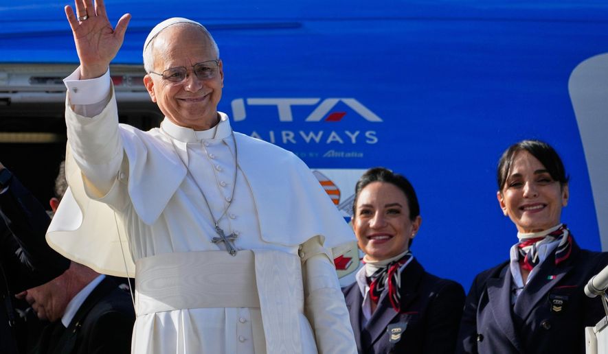 Pope Leo XIV waves as he boards a flight back to the Vatican after his visit to Lebanon at Beirut International Airport in Beirut, Lebanon, Tuesday, Dec. 2, 2025. (AP Photo/Hussein Malla)