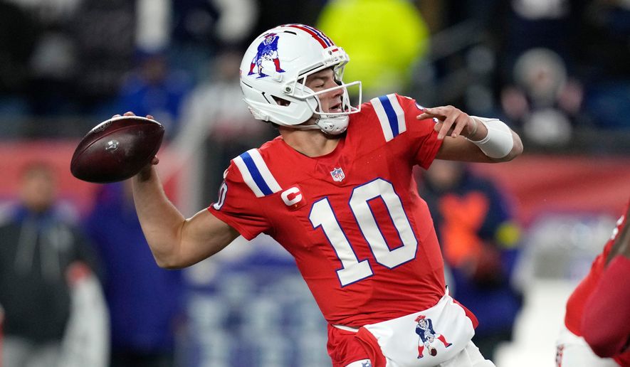 New England Patriots quarterback Drake Maye looks to pass against the New York Giants during the first half of an NFL football game Monday, Dec. 1, 2025, in Foxborough, Mass. (AP Photo/Charles Krupa)