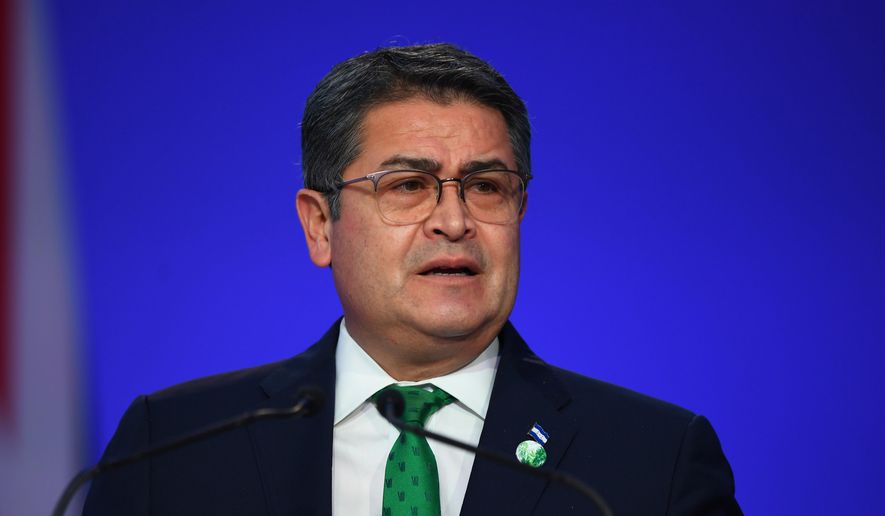 Honduran President Juan Orlando Hernandez speaks during the opening ceremony of the U.N. Climate Change Conference COP26 in Glasgow, Scotland, Monday, Nov. 1, 2021. Andy Buchanan/Pool via AP, File)