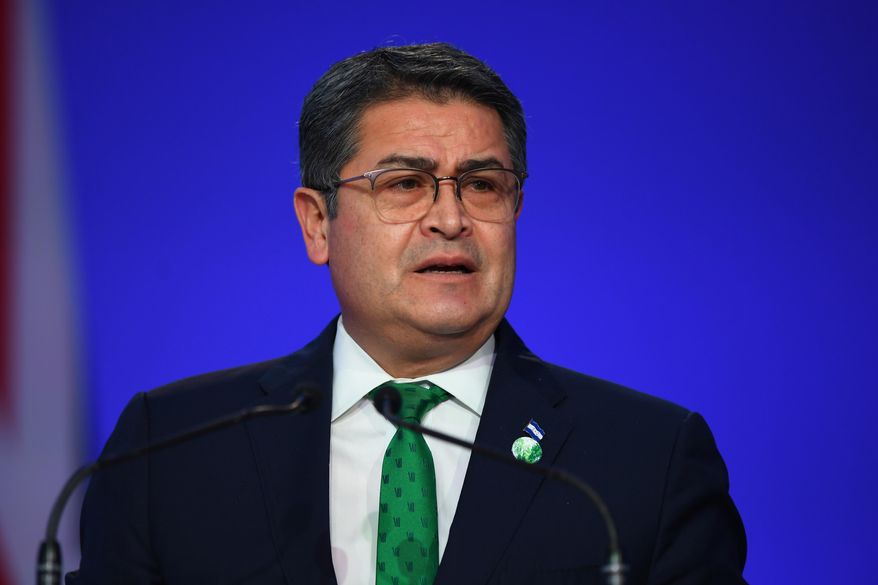 Honduran President Juan Orlando Hernandez speaks during the opening ceremony of the U.N. Climate Change Conference COP26 in Glasgow, Scotland, Monday, Nov. 1, 2021. Andy Buchanan/Pool via AP, File)