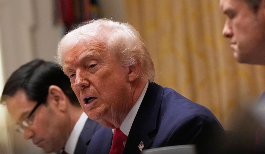 President Donald Trump speaks during a Cabinet meeting at the White House, Tuesday, Dec. 2, 2025, in Washington, with Secretary of State Marco Rubio, seated left and Defense Secretary Pete Hegseth, seated left. (AP Photo/Julia Demaree Nikhinson)