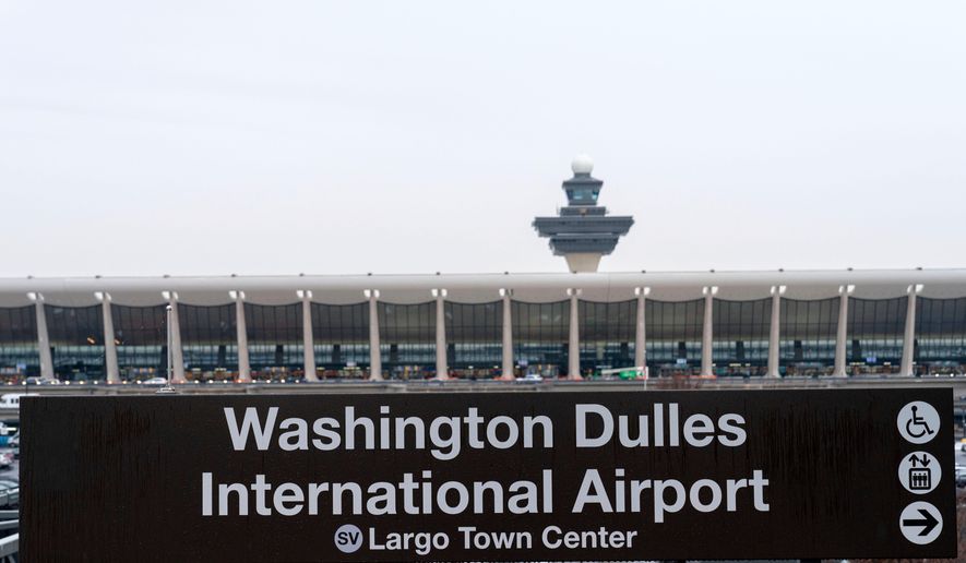 A sign of Washington Dulles International Airport station is seen during the opening of new Silver Line Extension at Washington Dulles International Airport, in Chantilly, Va., Nov. 15, 2022. (AP Photo/Jose Luis Magana, File)