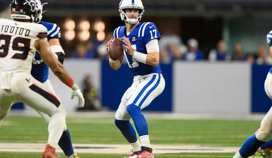 Indianapolis Colts quarterback Daniel Jones (17), wearing a special pad on his lower left leg, throws a pass during an NFL football game against the Houston Texans, Sunday, Nov. 30, 2025, in Indianapolis. (AP Photo/Zach Bolinger)