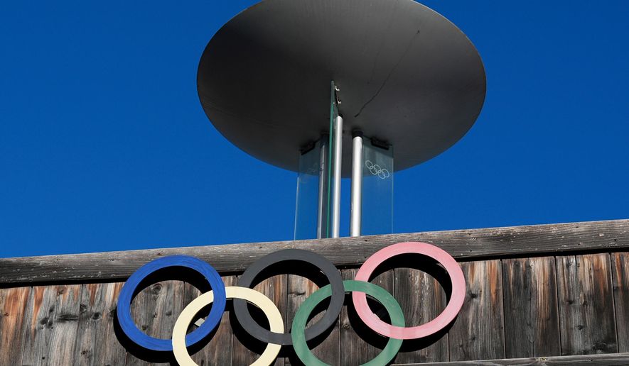 The Olympic rings adorn the Stadio Olimpico del Ghiaccio, which will be called Cortina Curling Olympic Stadium, venue for the curling discipline at the Milan Cortina 2026 Winter Olympics, in Cortina d'Ampezzo, Italy, Thursday, Jan. 16, 2025. (AP Photo/Giovanni Auletta, File)