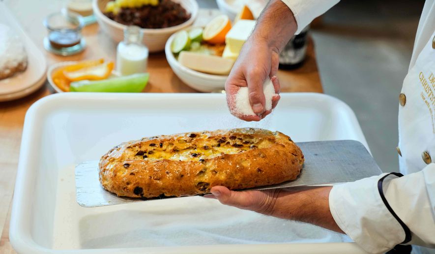 Pastry chef Tino Gierig makes stollen a traditional Christmas pastry in Dresden, Germany, Tuesday, Nov. 11, 2025. (AP Photo/Ebrahim Noroozi)