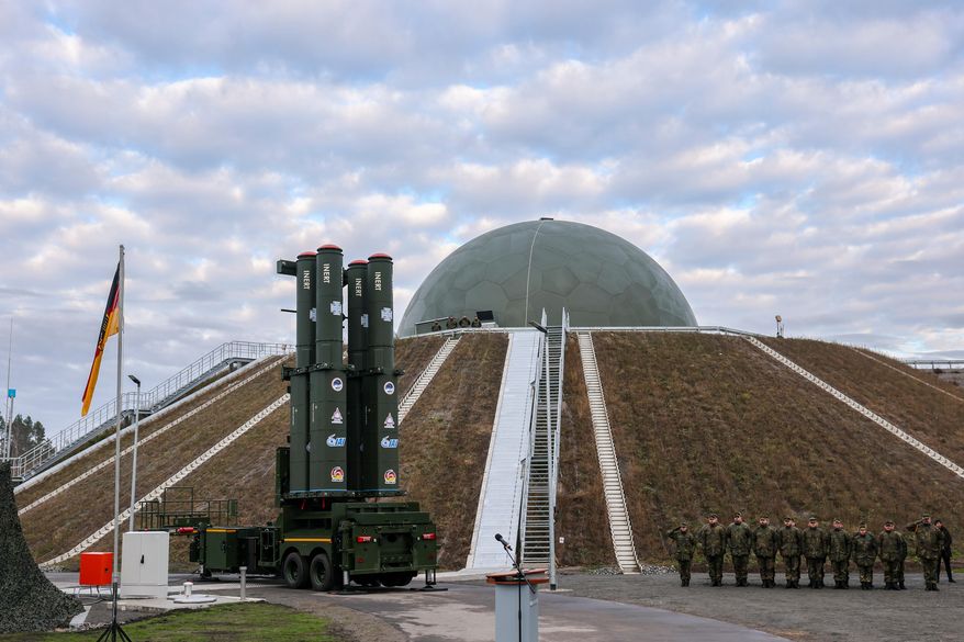 The launcher of the new Arrow 3 missile defense system stands in front of the radome in Annaburger Heide, Germany, Wednesday, Dec. 3, 2025. (Jan Woitas/dpa via AP)