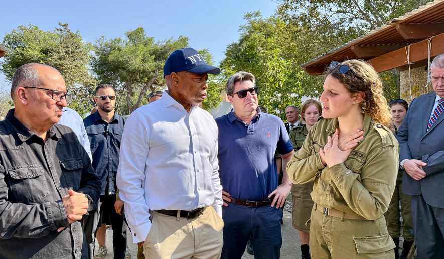 This image released by the Mayoral Photography Office shows New York Mayor Eric Adams, second left, during his visit to Kibbutz Kfar Aza, Nov. 18, 2025, which was attacked during the October 7th terrorist attacks on Israel. (Benny Polatseck/Mayoral Photography Office via AP)