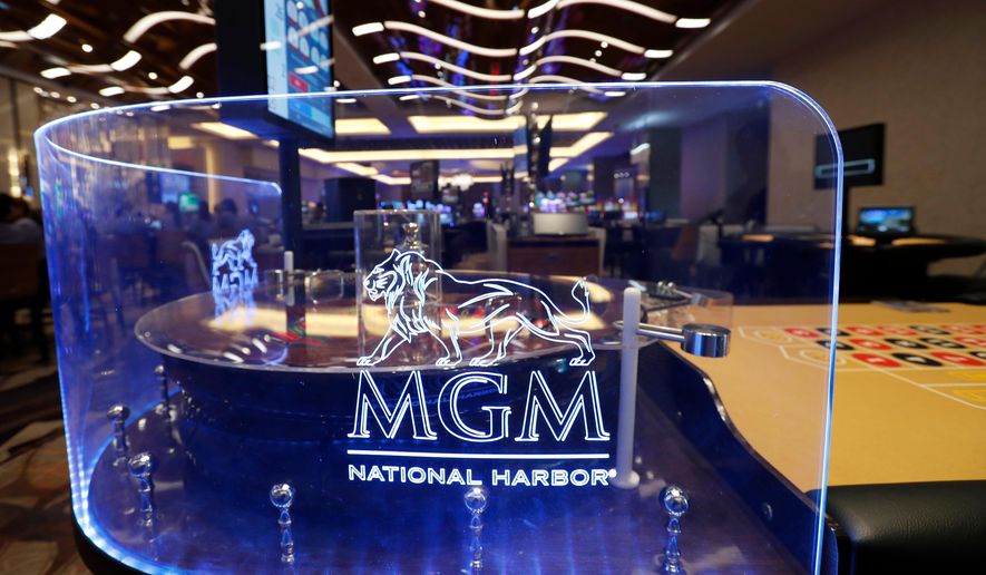 The MGM National Harbor logo is seen around a roulette wheel in the casino during a preview tour of the MGM National Harbor in Oxon Hill, Md., on Dec. 2, 2016. (AP Photo/Alex Brandon) **FILE**