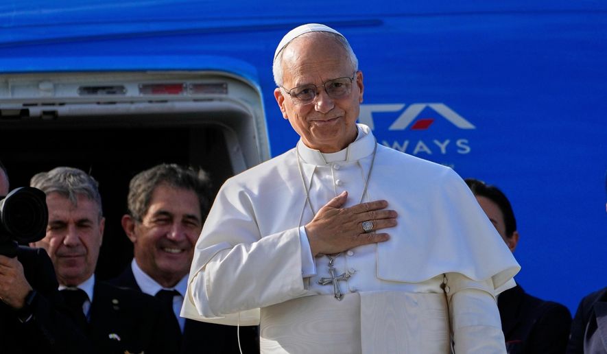 FILE - Pope Leo XIV gestures as he boards a flight back to the Vatican, in Beirut, Lebanon, on Dec. 2, 2025. (AP Photo/Hussein Malla, File)