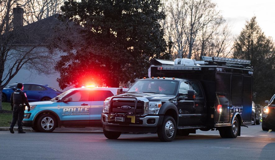 An FBI truck departs the street where the FBI made an arrest and are investigating a house in Woodbridge, Va., Thursday, Dec. 4, 2025. (AP Photo/Cliff Owen)