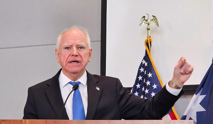 Democratic Gov. Tim Walz, speaking at a news conference on Thursday, Dec. 4, 2025, in St. Paul, denounces President Donald Trump for calling Minnesota's Somali community "garbage" and dismissing the state as a "hellhole." (AP Photo/Steve Karnowski) ** FILE **
