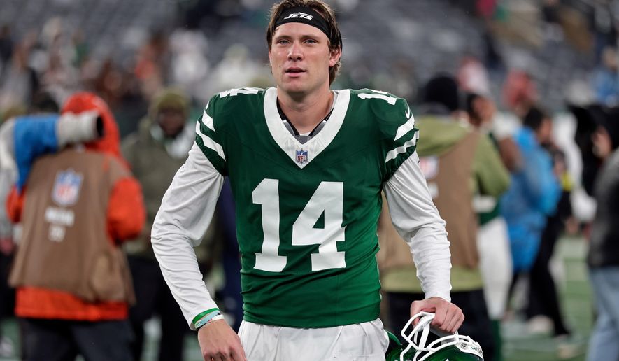 FILE - New York Jets punter Austin McNamara (14) walks off the field after an NFL football game against the Cleveland Browns, Nov. 9, 2025, in East Rutherford, N.J. (AP Photo/Adam Hunger, File)