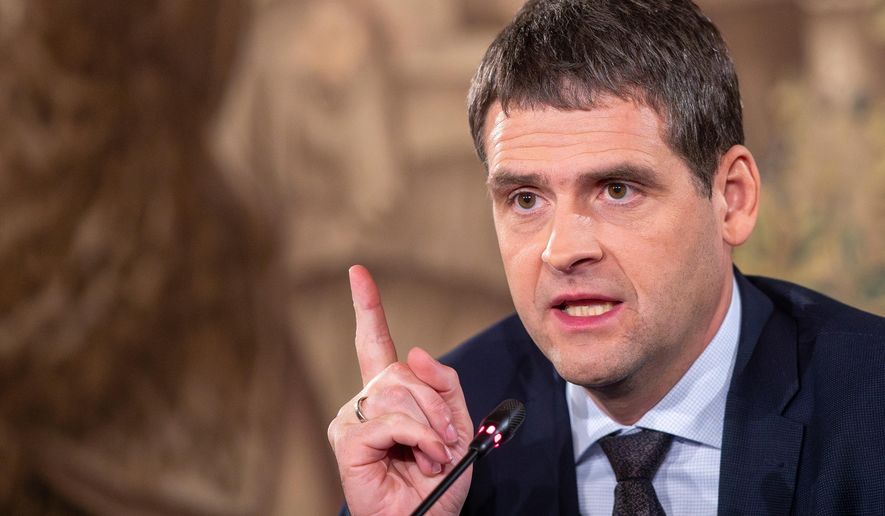 FILE -Leader of the Nemuno Aušra (Nemunas Dawn) party Remigijus Žemaitaitis, speaks at a press conference after a first round of Lithuania's parliamentary election, in Vilnius, Lithuania, Oct. 14, 2024. (AP Photo/Mindaugas Kulbis, File)