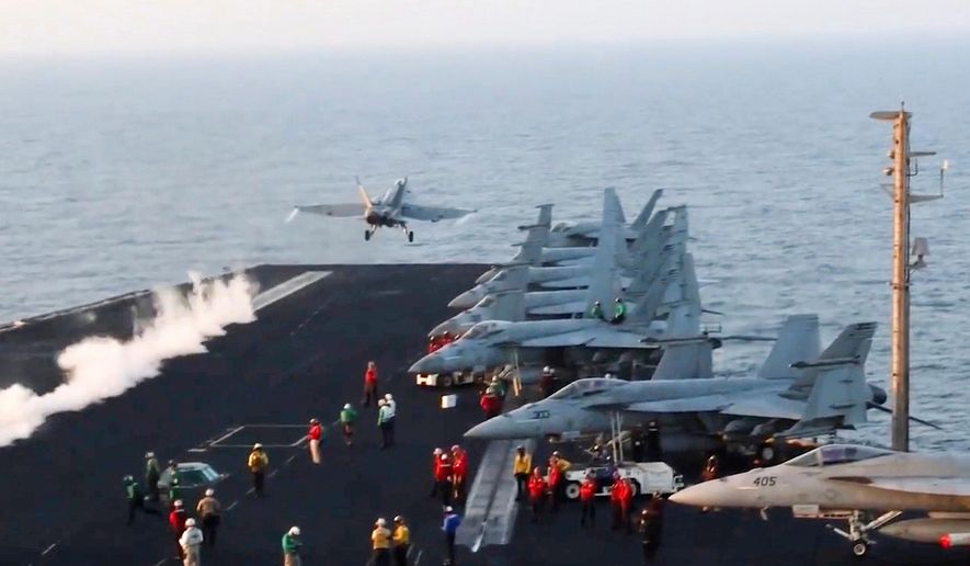FILE - This image taken from video provided by the U.S. Navy shows an aircraft launching from the USS Harry S. Truman in the Red Sea before airstrikes in Sanaa, Yemen, March 15, 2025. (U.S. Navy via AP, File)