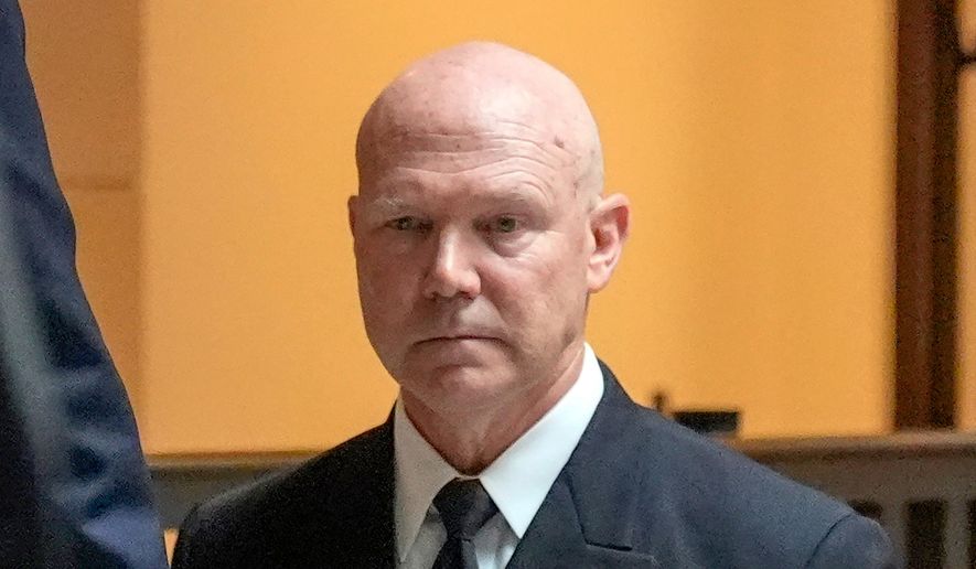U.S. Navy Adm. Frank M. Bradley walks to a meeting with senators on Capitol Hill, Thursday, Dec. 4, 2025, in Washington. (AP Photo/Mark Schiefelbein) ** FILE **