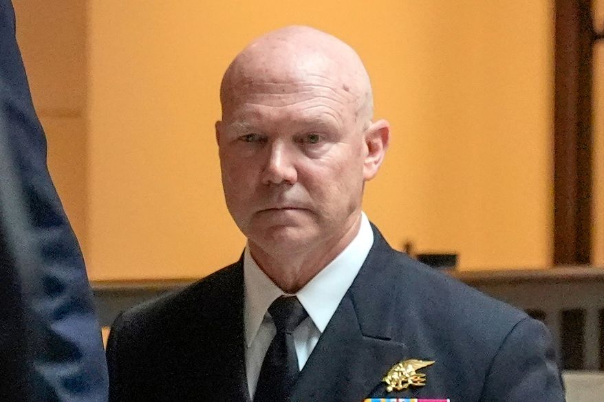 U.S. Navy Adm. Frank M. Bradley walks to a meeting with senators on Capitol Hill, Thursday, Dec. 4, 2025, in Washington. (AP Photo/Mark Schiefelbein) ** FILE **