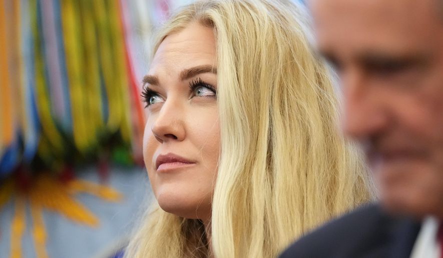 Erika Kirk listens as President Donald Trump speaks before Sergio Gor was sworn-in as U.S. Ambassador to India in the Oval Office of the White House, Monday, Nov. 10, 2025, in Washington. (AP Photo/Jacquelyn Martin)