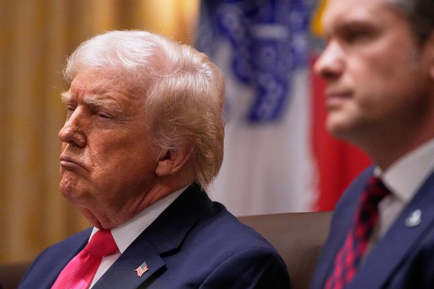 President Donald Trump and Defense Secretary Pete Hegseth listen, during a Cabinet meeting at the White House, Tuesday, Dec. 2, 2025, in Washington. (AP Photo/Julia Demaree Nikhinson)