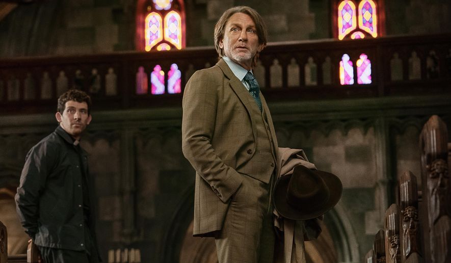 This image released by Netflix shows Josh O'Connor, left, and Daniel Craig in a scene from "Wake Up Dead Man: A Knives Out Mystery." (John Wilson/Netflix via AP)