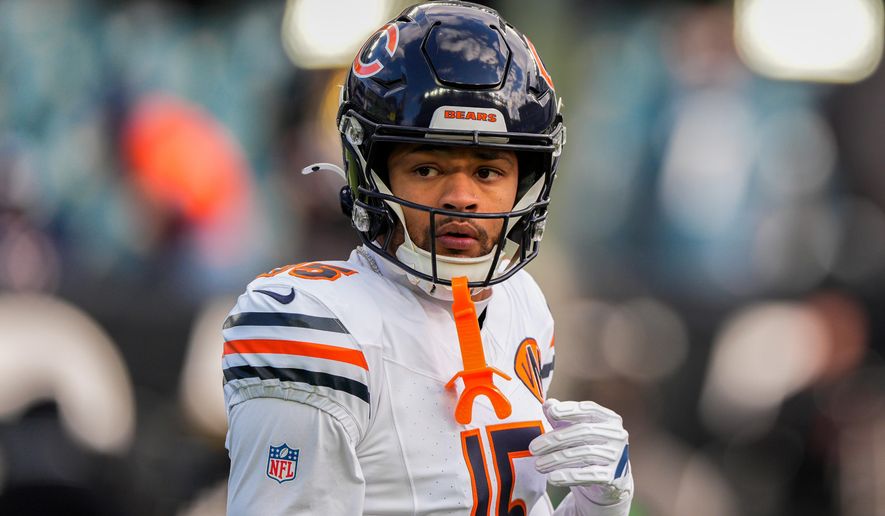 Chicago Bears wide receiver Rome Odunze (15) warms up before an NFL football game against the Philadelphia Eagles, Friday, Nov. 28, 2025, in Philadelphia. (AP Photo/Chris Szagola)