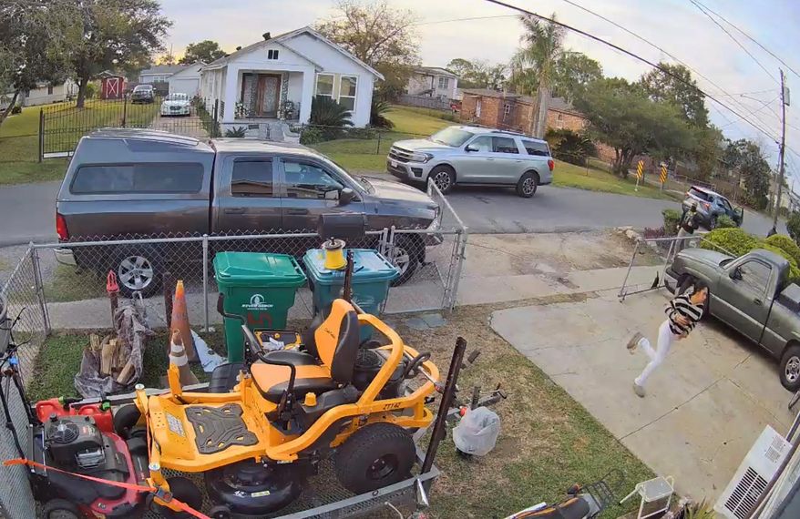 This cam footage provided by Juan Anglin shows Jacelynn Guzman, Anglin's U.S. citizen step-daughter, running from federal agents outside his home in Marrero, La., Wednesday, Dec. 3, 2025. (Juan Anglin via AP)