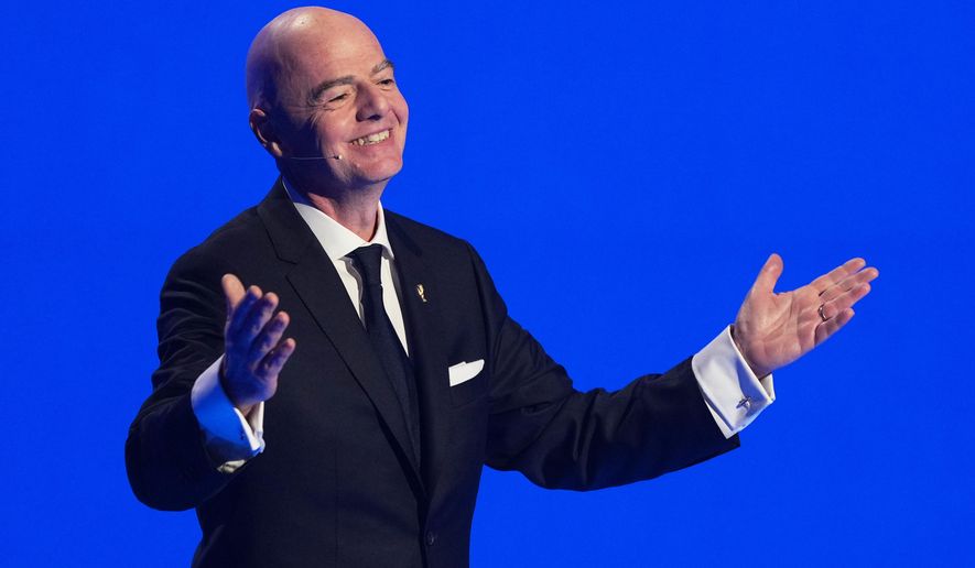 FIFA President Gianni Infantino speaks during the draw for the 2026 soccer World Cup at the Kennedy Center in Washington, Friday, Dec. 5, 2025. (AP Photo/Stephanie Scarbrough, Pool)