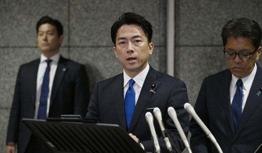 Japan's Defense Minister Shinjiro Koizumi, center, speaks to the media, as Japan announced that a Chinese military aircraft locked its radar on Japanese jets, at the ministry in Tokyo, Sunday, Dec. 7, 2025. (Kyodo News via AP) ** FILE **