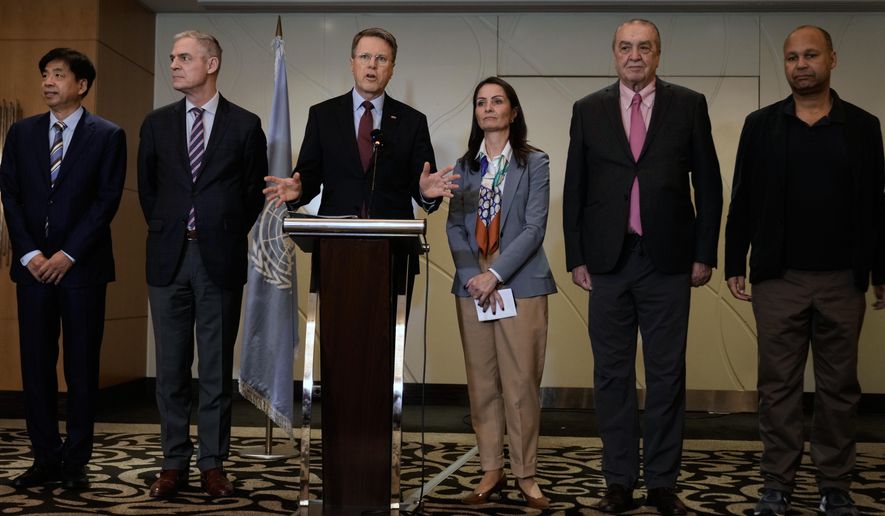 Samuel Zbogar, third left, Slovenia's permanent representative to the United Nations and president of the Security Council, delivers a statement with his delegation in Beirut, Lebanon, Saturday, Dec. 6, 2025. (AP Photo/Bilal Hussein)