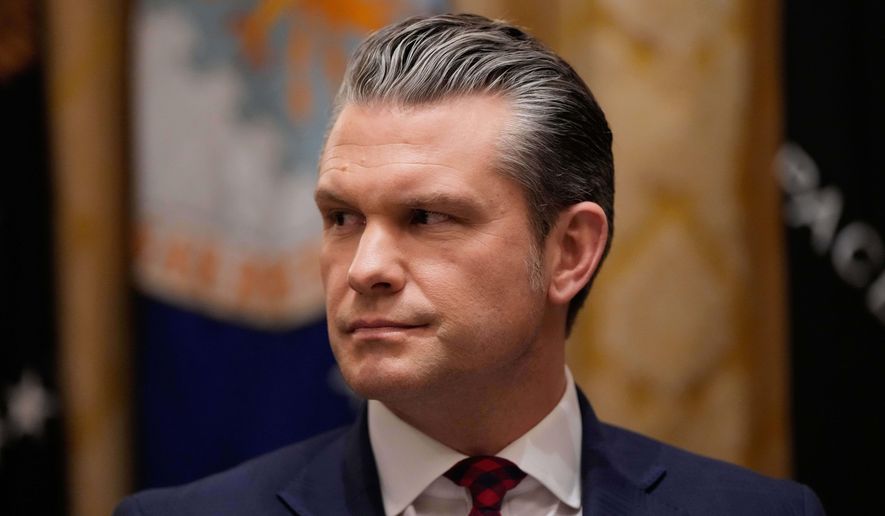 Defense Secretary Pete Hegseth listens as President Donald Trump speaks during a Cabinet meeting at the White House, Tuesday, Dec. 2, 2025, in Washington. (AP Photo/Julia Demaree Nikhinson)
