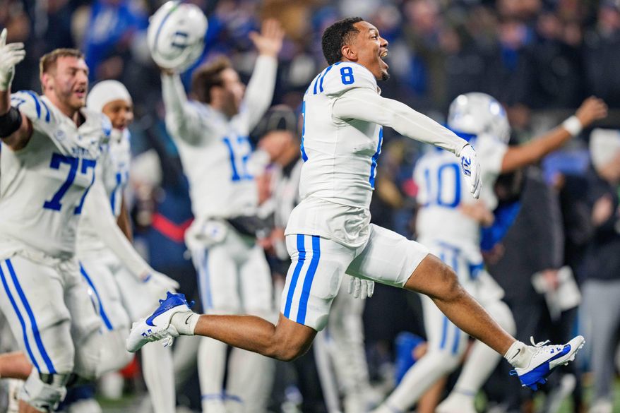 Duke wide receiver Jayden Moore (8) reacts after winning the Atlantic Coast Conference championship NCAA college football game against Virginia, Saturday, Dec. 6, 2025, in Charlotte, N.C. (AP Photo/Jacob Kupferman)