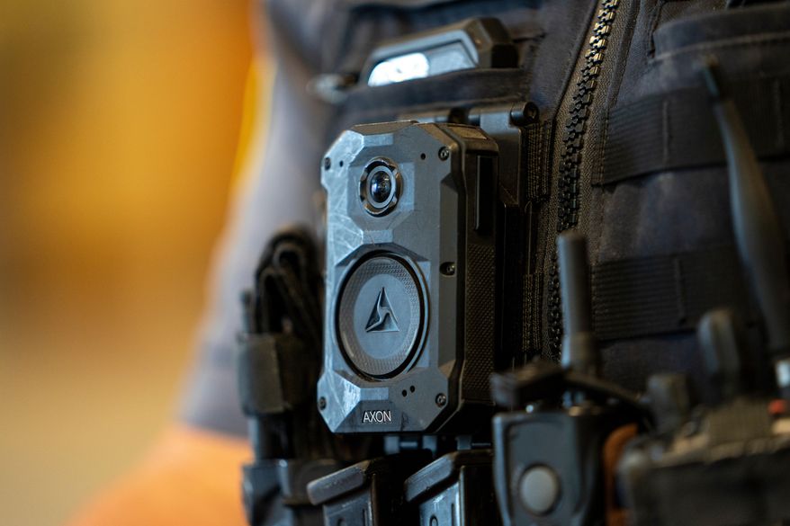 FILE - An Axon body camera is worn by MSGT Matt Gilmore who is one of the officers using Axon's Draft One AI software at OKCPD headquarters on Friday, May 31, 2024 in Oklahoma City, Oklahoma. (AP Photo/Nick Oxford, File)