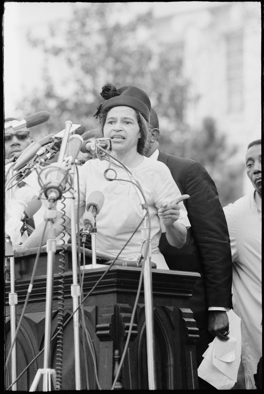 Rosa Parks delivers remarks in front of the Alabama State Capitol at the conclusion of the 54 mile march from Selma to Montgomery. Alabama State Capitol, Montgomery, Ala., March 25, 1965. (Matt Herron/Jeannine Herron and Stanford University Libraries via AP)