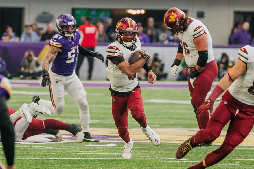Washington Commanders Quarterback Jayden Daniels (5) runs through open lane at U.S. Bank Stadium in Minneapolis, Minnesota. The Minnesota Vikings defeated the Washington Commanders 31-0 during NFL Week 14 on December 7th, 2025. (Photo by Jordan Sabillo for Washington Times)