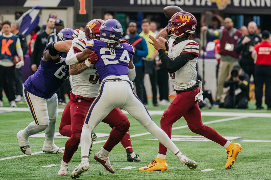 Washington Commanders Quarterback Jayden Daniels (5) throws pass in the pocket at U.S. Bank Stadium in Minneapolis, Minnesota. The Minnesota Vikings defeated the Washington Commanders 31-0 during NFL Week 14 on December 7th, 2025. (Photo by Jordan Sabillo for Washington Times)