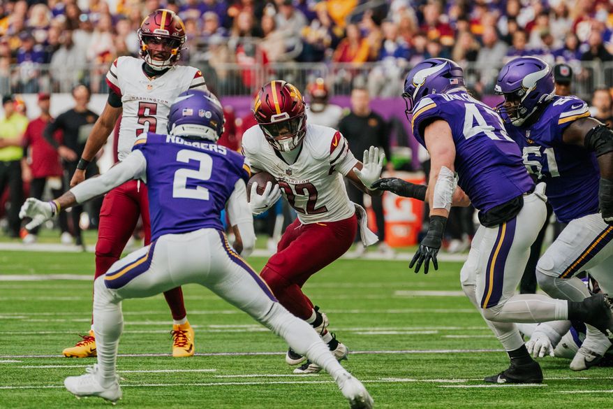 Washington Commanders Running Back Jacory Croskett-Merritt (22) runs through open lane at U.S. Bank Stadium in Minneapolis, Minnesota. The Minnesota Vikings defeated the Washington Commanders 31-0 during NFL Week 14 on December 7th, 2025. (Photo by Jordan Sabillo for Washington Times)