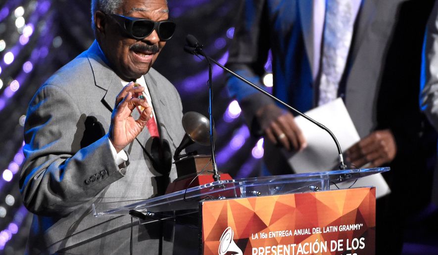 FILE - Rafael Ithier of El Gran Combo de Puerto Rico accepts the Lifetime Achievement Award at the Lifetime Achievement and Trustees Awards presentation at the Ka Theater in the MGM Grand Hotel on Wednesday, Nov. 18, 2015, in Las Vegas. (Photo by Chris Pizzello/Invision/AP, File)